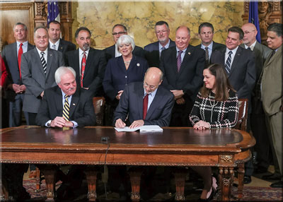 Senator Baker with Gov Wolf at bill signing