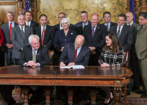 Sen. Lisa Baker looks on as Gov. Tom Wolf signs HB 319 into law on Nov. 3. Act 144 will help to ensure that seasonal workers and those who need unemployment insurance will have better and more efficient access to those funds