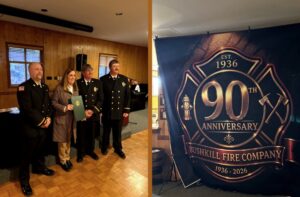 Sen. Baker presents citation to Bushkill firemen. 2nd picture - the fire company’s red and black 90th Anniversary Flag