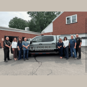 Sen. Baker & Rep. Pugh with Kingston Municipal Police Department in front of new gray and black “Police Municipality of Kingston” truck parked outside of municipal building