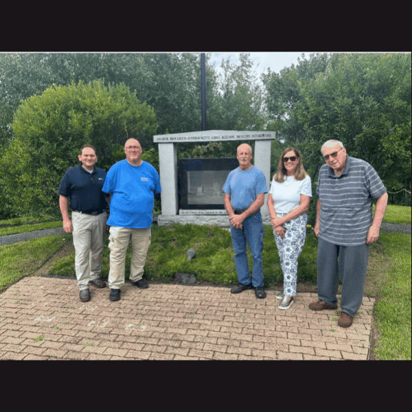 Sen. Baker with Huber Breaker Historical Society in front of memorial
