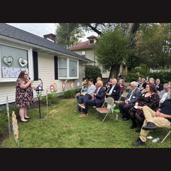&nbsp;Slideshow: Sen. Baker speaking outdoors at Green Trees Early Learning Center during ceremony, attendees gathered for the event.