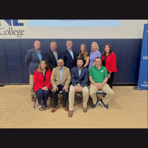 Slideshow: Sen. Baker at LCCC’s Skilled Trade Career Fair and LCCC’s President Yudichak giving a speech on stage in gymnasium.